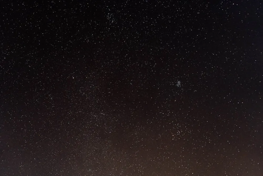 A mesmerizing view of the starry night sky captured in Královéhradecký kraj, Česko.